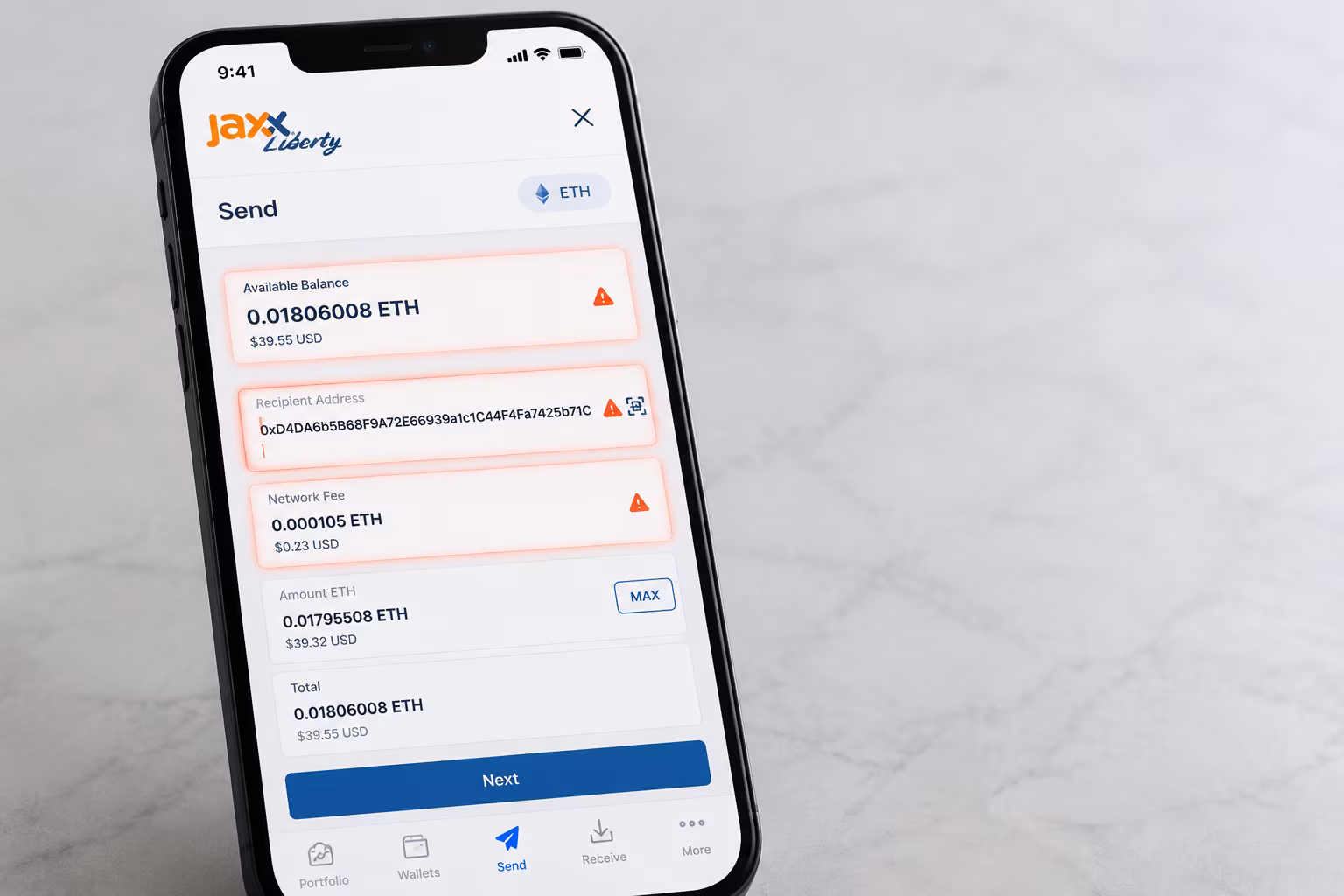 Jaxx Liberty send screen with warning highlights on balance and fee fields