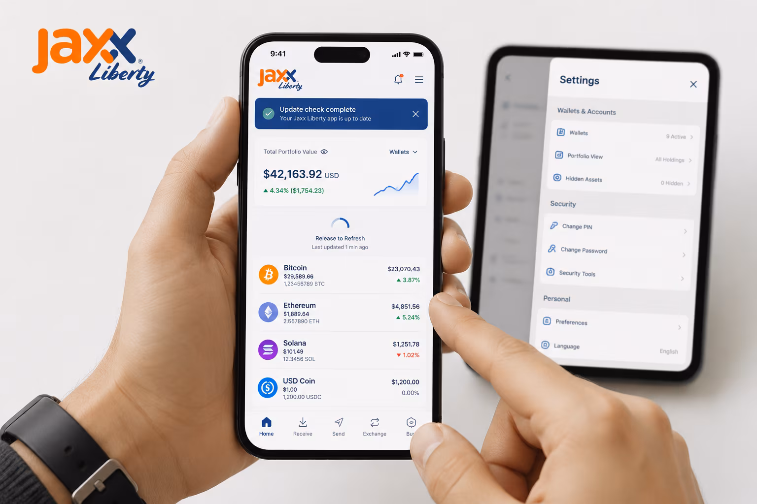 Hands refreshing Jaxx Liberty wallet and reviewing mobile settings